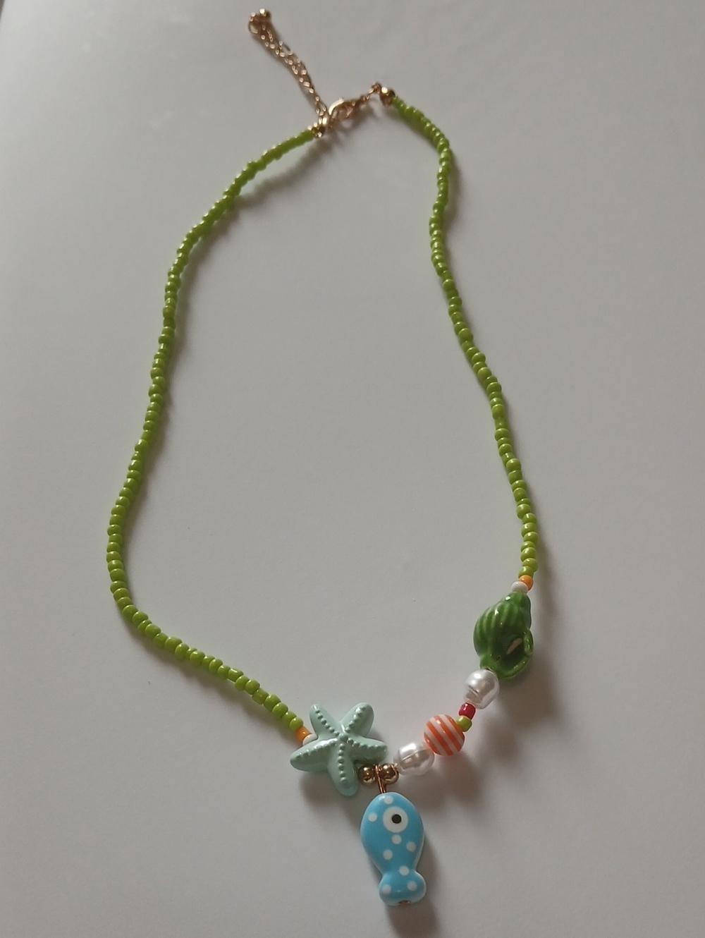 Beaded Green Sea Charm Necklace with Blue Fish Pendant